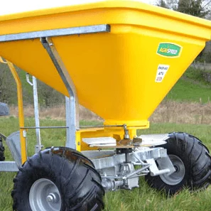 Yellow Aitchison spreader hopper on twin flotation wheels